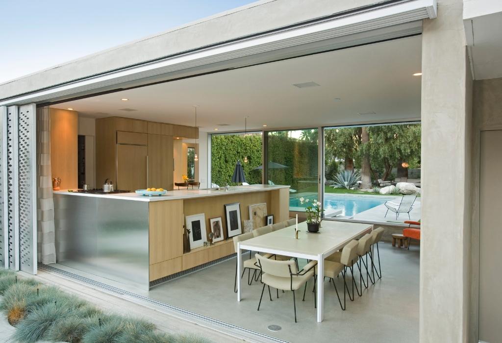 indoor-outdoor kitchen and dining area